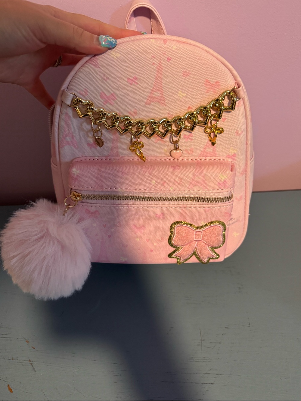 Under One Sky Pink Mini Backpack with Gold Charm Chain & Pom Pom